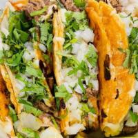Tacos Dorados · Cheesy Birria tacos comes with onions & cilantro . order of 3 comes w/ cup of consomé.