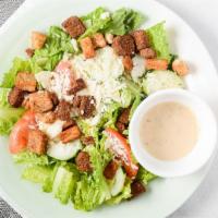 Caesar Salad · Romaine lettuce, green peppers, tomatoes, Parmesan cheese, red onions and croutons.