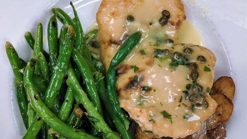 Pollo Limone · Pan-roasted chicken breast with lemon-caper sauce, accompanied by roasted garlic potatoes & seasonal vegetable. *Available Gluten-Free