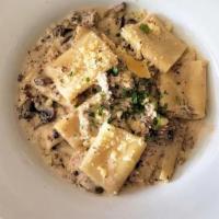 Paccheri Tartufati · Tender imported pasta, crumbled Italian sausage & mushroom, tossed in a rich truffle cream s...