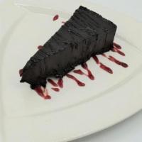Flourless Chocolate Cake · Rich, dark chocolate, served with a mixed berry drizzle.  *Available Gluten-Free