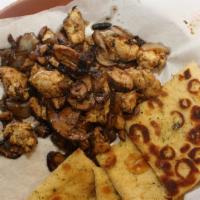 Chicken Bites · Marinated Chicken grilled in Cajun or BBQ spice with mushrooms and onions, served with pita ...