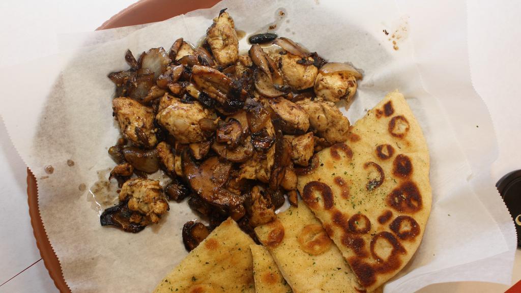 Chicken Bites · Marinated Chicken grilled in Cajun or BBQ spice with mushrooms and onions, served with pita bread and cole slaw.