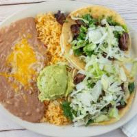 Mexican Street Tacos · Two corn or flour tortilla tacos filled with fajita beef or fajita chicken. Topped with lett...