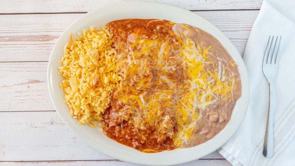 Enchilada Dinner · Fan Favorites. Choice of either two cheese and onion, shredded chicken or beef (ground or shredded) enchiladas topped with your choice of sauce.