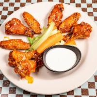 Wings O' Fire · Traditional bone-in wings tossed in buffalo sauce and sprinkled with sesame seeds. Served wi...