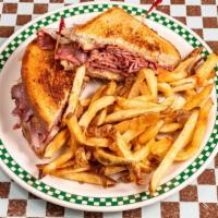 Classic Curragh Reuben · Sliced corned beef, sauerkraut, Swiss cheese and thousand island dressing on rye. Served wit...