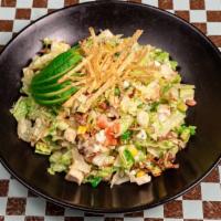 Chopped Salad · Chopped romaine with chicken, avocado, tomatoes, blue cheese, bacon, scallions, corn, and to...