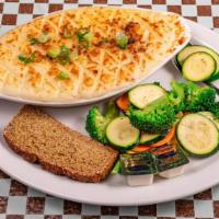 Shepherd'S Pie · Ground beef, carrots, peas, and onion topped with mashed potatoes. Served with mixed vegetab...