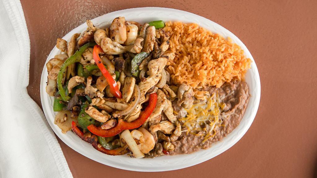 Fajitas Burrito  · Only Grilled chicken and shrimp with onions and green peppers.