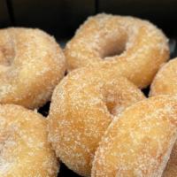 Dozen Mini Donuts · Warm donuts sugared or with syrup. (Two toppings) Sugars-plain sugar, powder, cinnamon and s...
