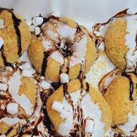 S'Mores · Mini donuts coated with Graham cracker crumbs topped with marshmallow fluff and chocolate sy...