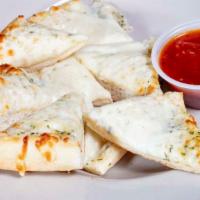 Cheesy Bread · Garlic bread oven baked with mozzarella cheese on top, served with our homemade red sauce.