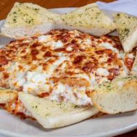 Baked Mostaccioli · Served with our homemade red sauce and oven baked with ricotta and mozzarella cheeses until ...