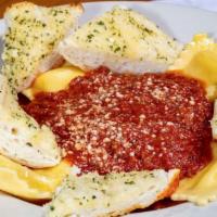 Jumbo Ravioli · Meat or cheese raviolis topped with our homemade red sauce and a sprinkle of parmesan cheese.