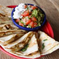 Quesadilla Mexicana · Two grilled flour tortillas, one filled with shredded chicken, refried beans & cheese and on...