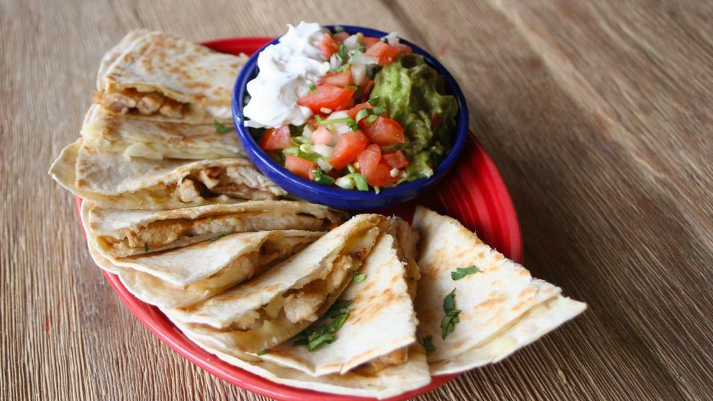 Quesadilla Mexicana · Two grilled flour tortillas, one filled with shredded chicken, refried beans & cheese and one filled with shredded beef, refried beans & cheese. Served with shredded lettuce, tomatoes and sour cream.