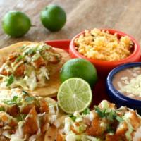 Baja Fish Tacos · Fried cod with jalapeño coleslaw, cilantro-lime crema onions and cilantro.