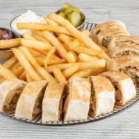 Arabic Chicken Shawarma · Chicken shawarma on shrak bread toasted and cut, comes with garlic sauce, pickles and side o...