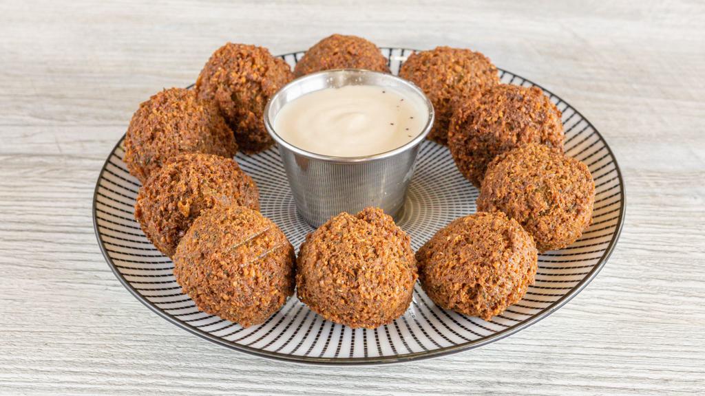Falafel · Grounded chickpeas, parsley, garlic, and an array of spices deep fried and served with tahini.