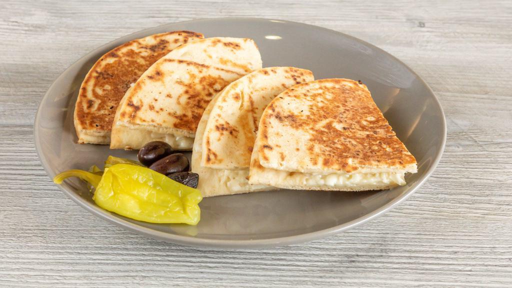 Arayes With Cheese · Fresh baked pita bread stuffed with queso cheese.