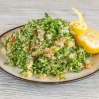Tabbouleh Salad · Fine Chopped mix of parsley, mint, tomatoes, onions, mixed with cracked wheat, lemon juice &...
