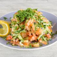 Arabic Salad · Made fresh daily, fine mix of diced tomatoes, cucumbers, lemon juice, topped with olive oil.