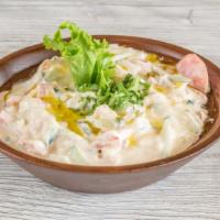Jerusalem Salad · Made fresh daily, fine mix of diced tomatoes, cucumbers, in tahini sauce, with lemon juice, ...
