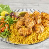Chicken Shish Tawook Plate · 2 skewers of grilled chicken (chicken cubes), rice.  Comes with hummus, and mixed salad.
