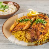 Seafood Grilled · 1 salmon, 1 tilapia, 5 pieces shrimp and rice. Comes with Jerusalem salad.