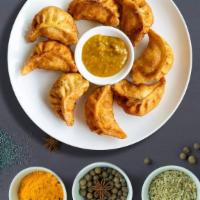 Fry That Veggie Momo · Ground cabbage, carrot, and onion combined with ajino moto, century momo masala, sauteed in ...
