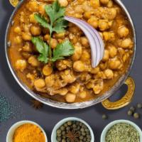 It'S The Chana Masala For Me · Chickpeas traditionally cooked in heavy whipping cream, onion gravy, tomato gravy and our ho...
