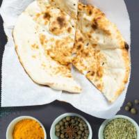 Classic Naan · Traditional Indian grilled bread made of flour, milk, water, salt and baking powder.