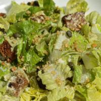 Caesar Salad · Romaine lettuce and croutons tossed with Caesar dressing. Topped with hemp parmesan cheese a...