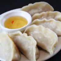 Pot Stickers (6) · Rice dumpling filled with your choice of chicken, pork or vegetables steamed and then pan-se...