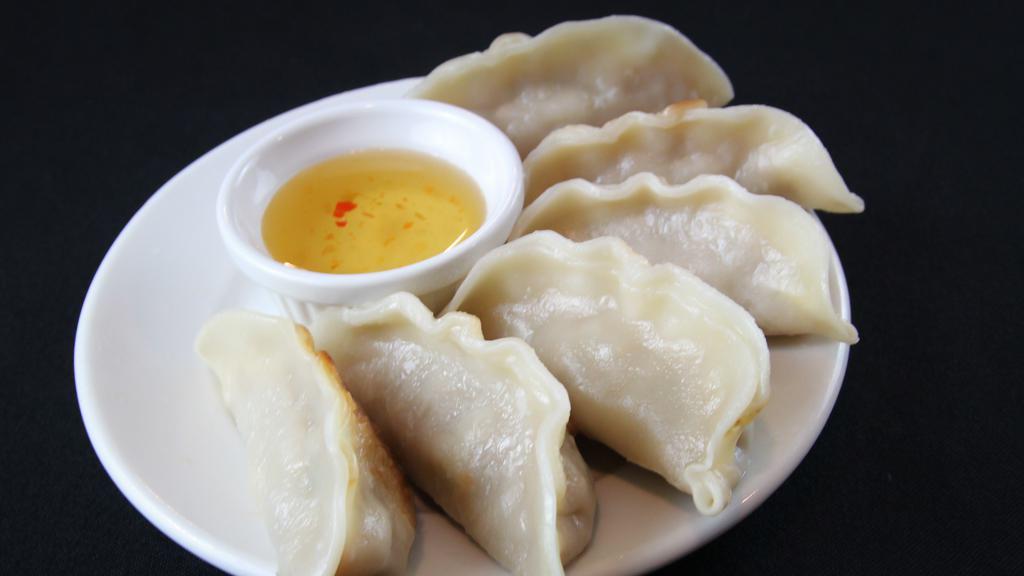 Pot Stickers (6) · Rice dumpling filled with your choice of chicken, pork or vegetables steamed and then pan-seared.