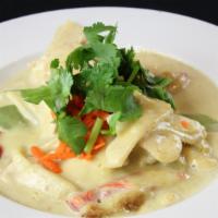 Green Curry · Spicy Thai curry with coconut milk, bamboo shoots, bell peppers, basil and your choice of me...