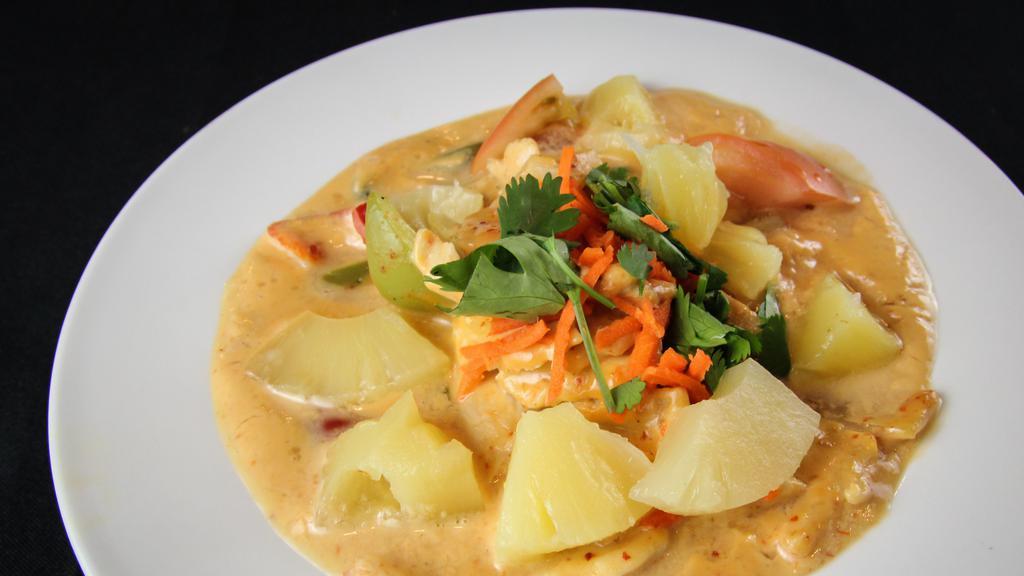 Pineapple Curry · Your choice of meat or tofu, mixed with red coconut curry, sweet pineapple chunks and fresh tomatoes. Vegan and gluten-free preparations available upon request.