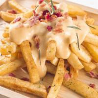 Gangster Fries · Deep-fried golden crunchy fries topped with our ranch sauce, cheddar cheese, sizzling bacon ...