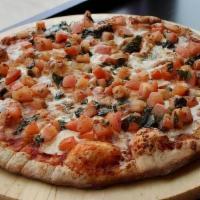 Margherita Pizza · Fresh Mozzarella Cheese, Fresh Tomato & Basil.