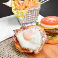 Egg Burger · Meat Patty, Cheese, Halal Bacon, Eggs, Lettuce, Tomatoes, Onions and Alanos Sauce, With A Si...
