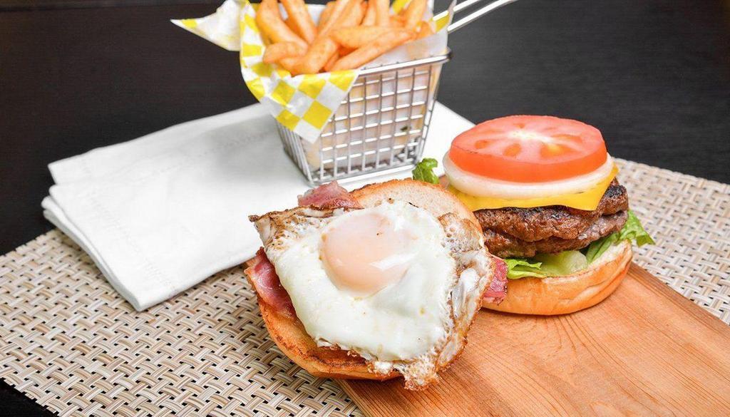 Egg Burger · Meat Patty, Cheese, Halal Bacon, Eggs, Lettuce, Tomatoes, Onions and Alanos Sauce, With A Side Of Fries