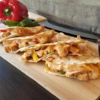 Chicken Quesadilla · OnIons, Green Peppers, Mexican Cheese, 
& SW Sauce served with a side of sour 
cream and mil...