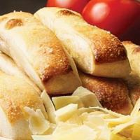 Garlic Bread Stix · Breadsticks dipped in Garlic Butter topped with Parmesan 
Cheese and served with a side of M...