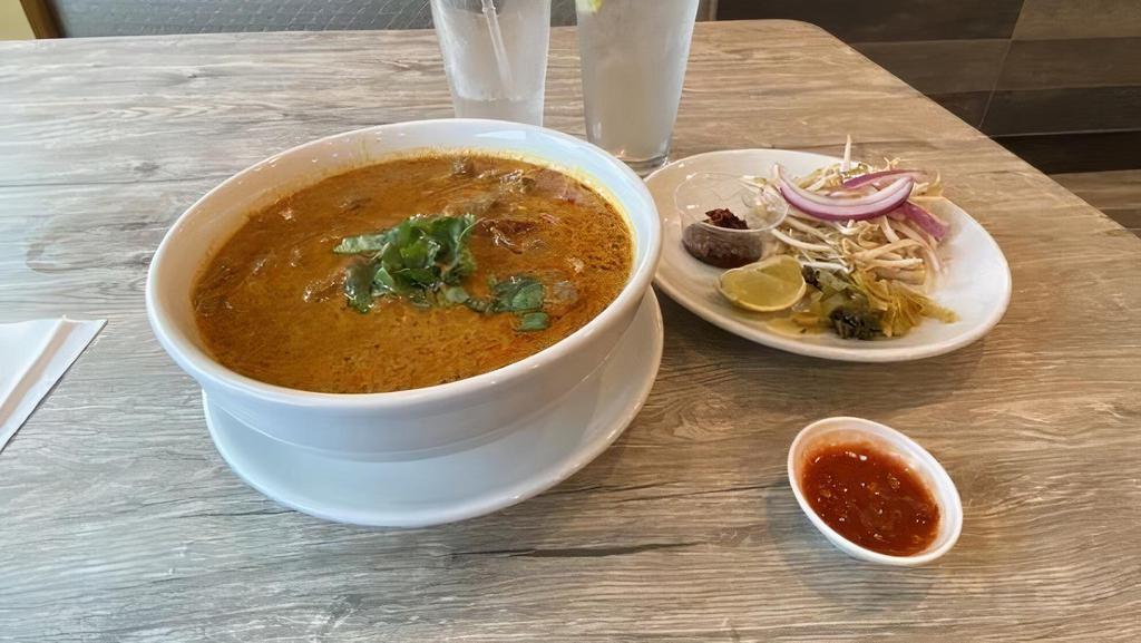 Khao Soi Curry Noodles · Chicken or beef only. Egg noodles with choice of chicken or beef, bean sprouts, red onions in curry sauce served with fresh lime.