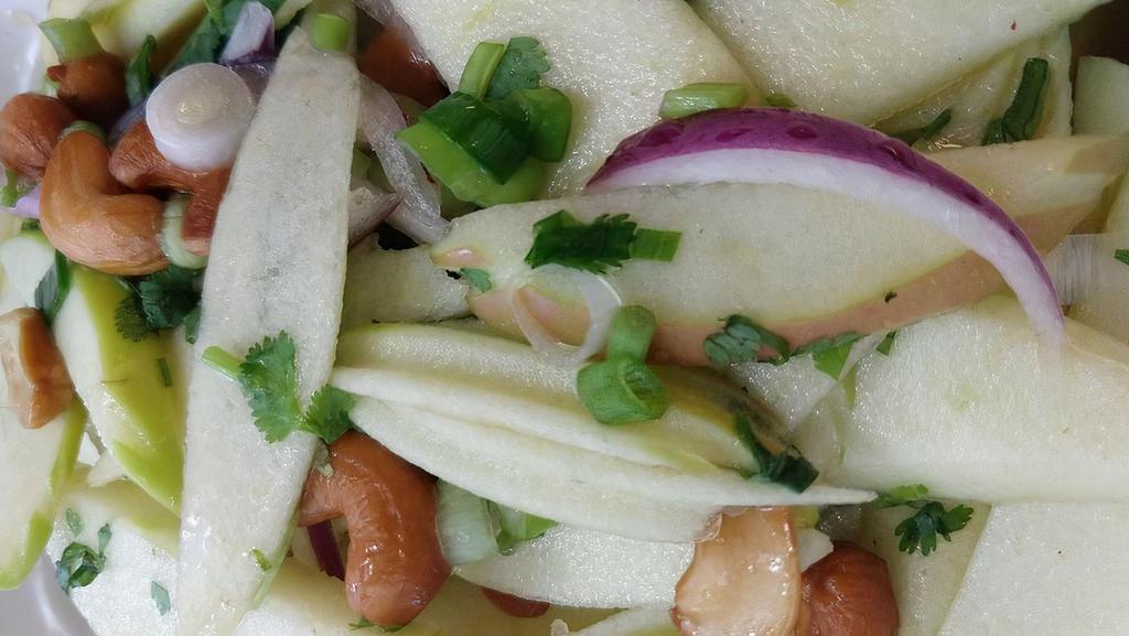 Apple Salad · Sliced green apple, cashew, red onions, green onions and cilantro with brown sugar tamarind vinaigrette.