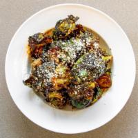 Crispy Brussels · Crispy brussels sprouts, chipotle agave glaze, cotija cheese.