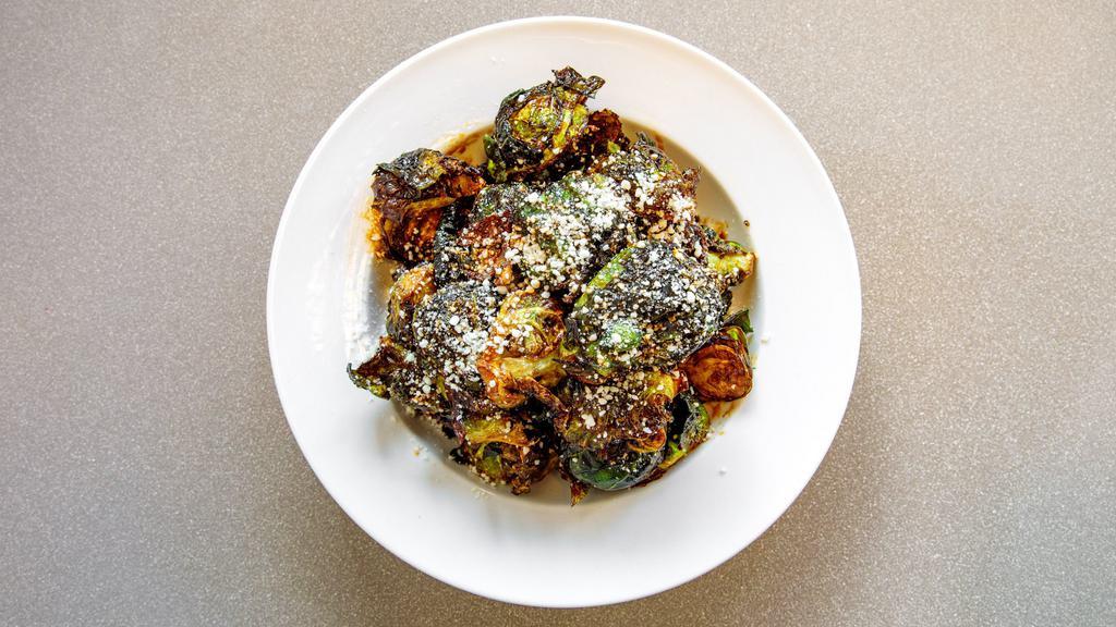 Crispy Brussels · Crispy brussels sprouts, chipotle agave glaze, cotija cheese.