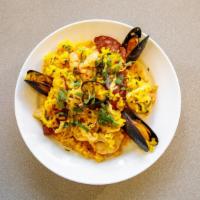Paella · Jumbo shrimp, mussels, smoked chicken, chorizo, rice.