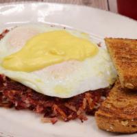 Corned Beef Hash · Two eggs served your way, topped with crafted hollandaise and served with toast.